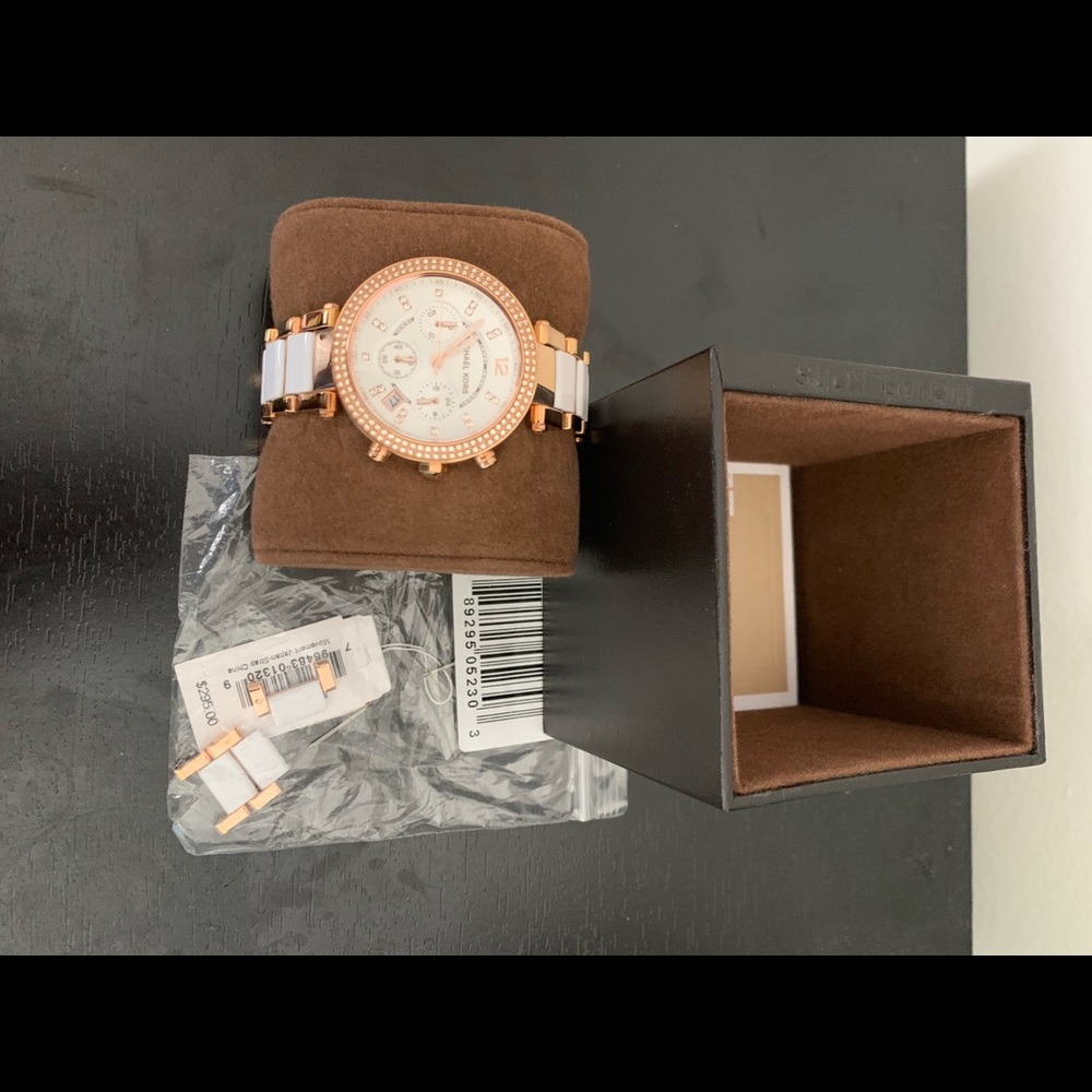 Michael Kors rose gold and white woman’s watch